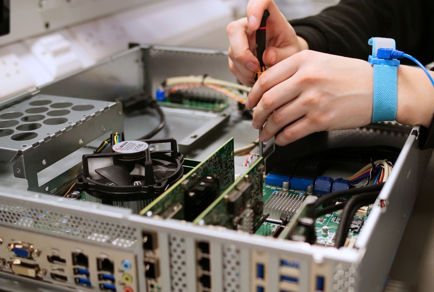 Production Technician building PC.