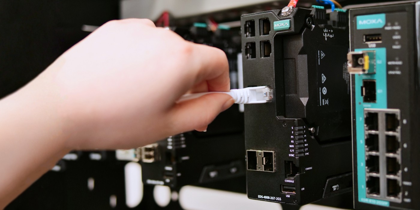 Engineer Connecting Networking Devices