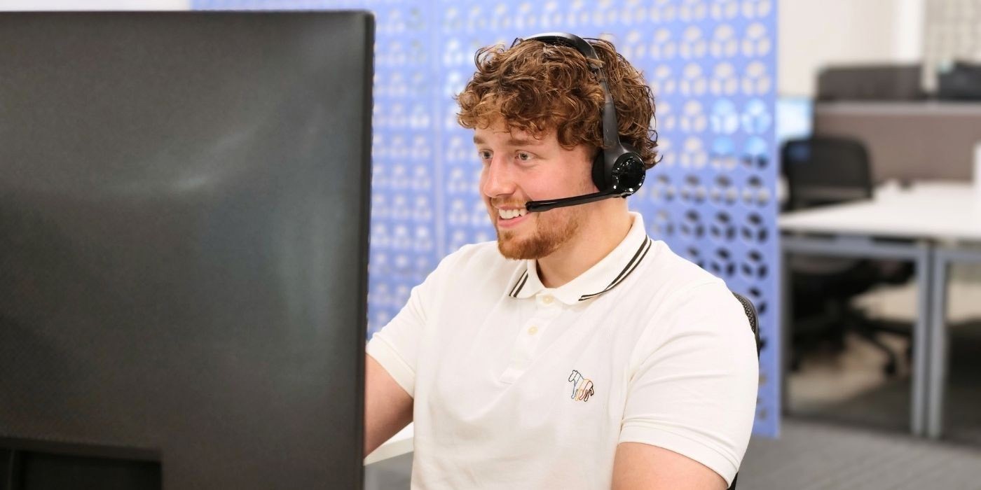 A member of the sales team speaking to a customer on the phone.