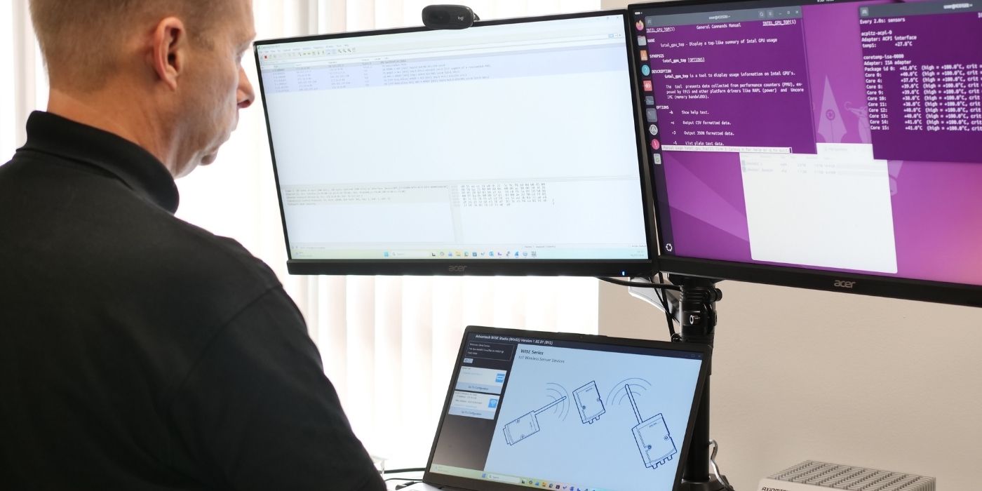 Engineer using in-house remote benchmarking system to test a device.